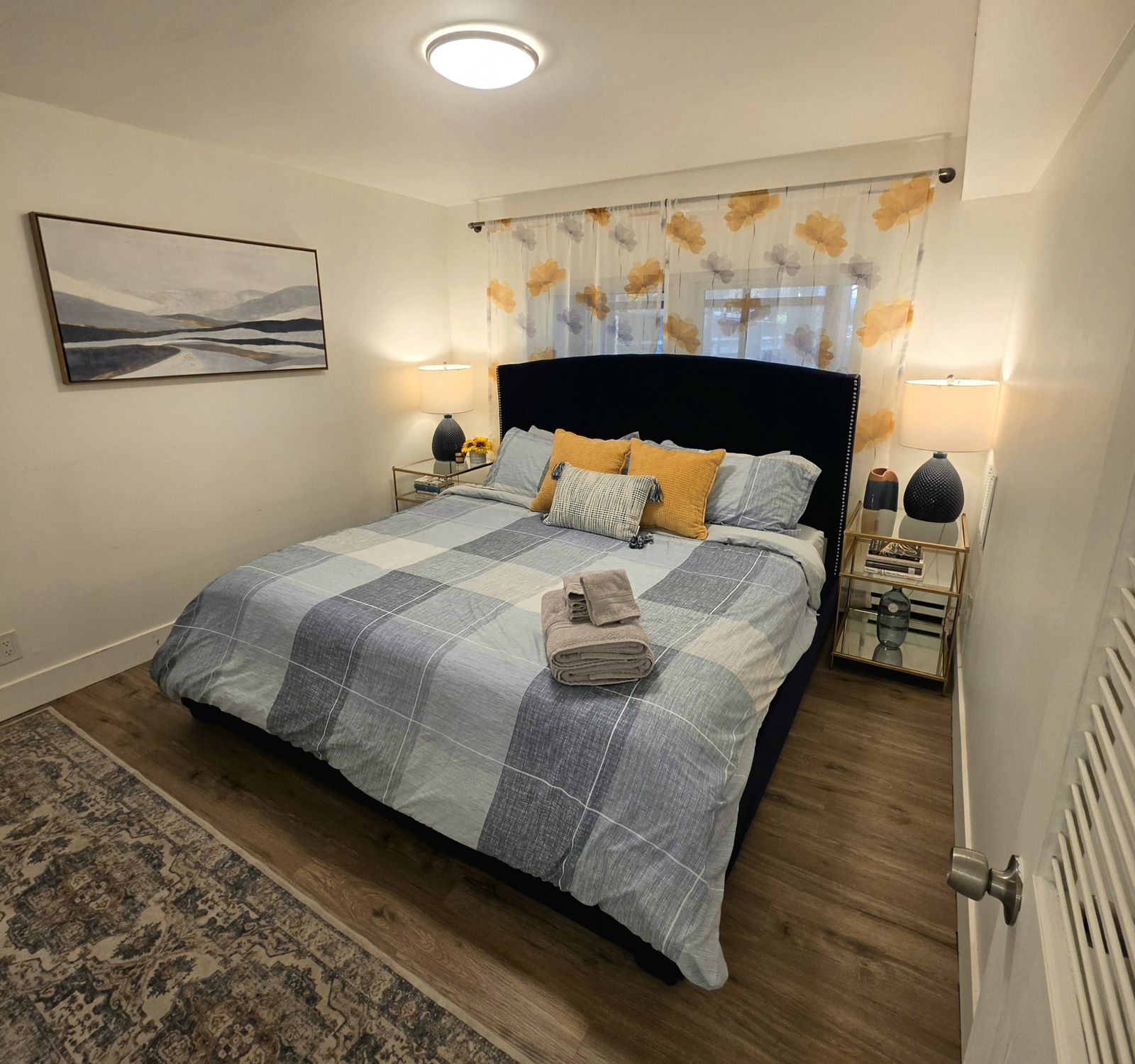 Apartment 1 bedroom with a king bed and blue plaid bedding