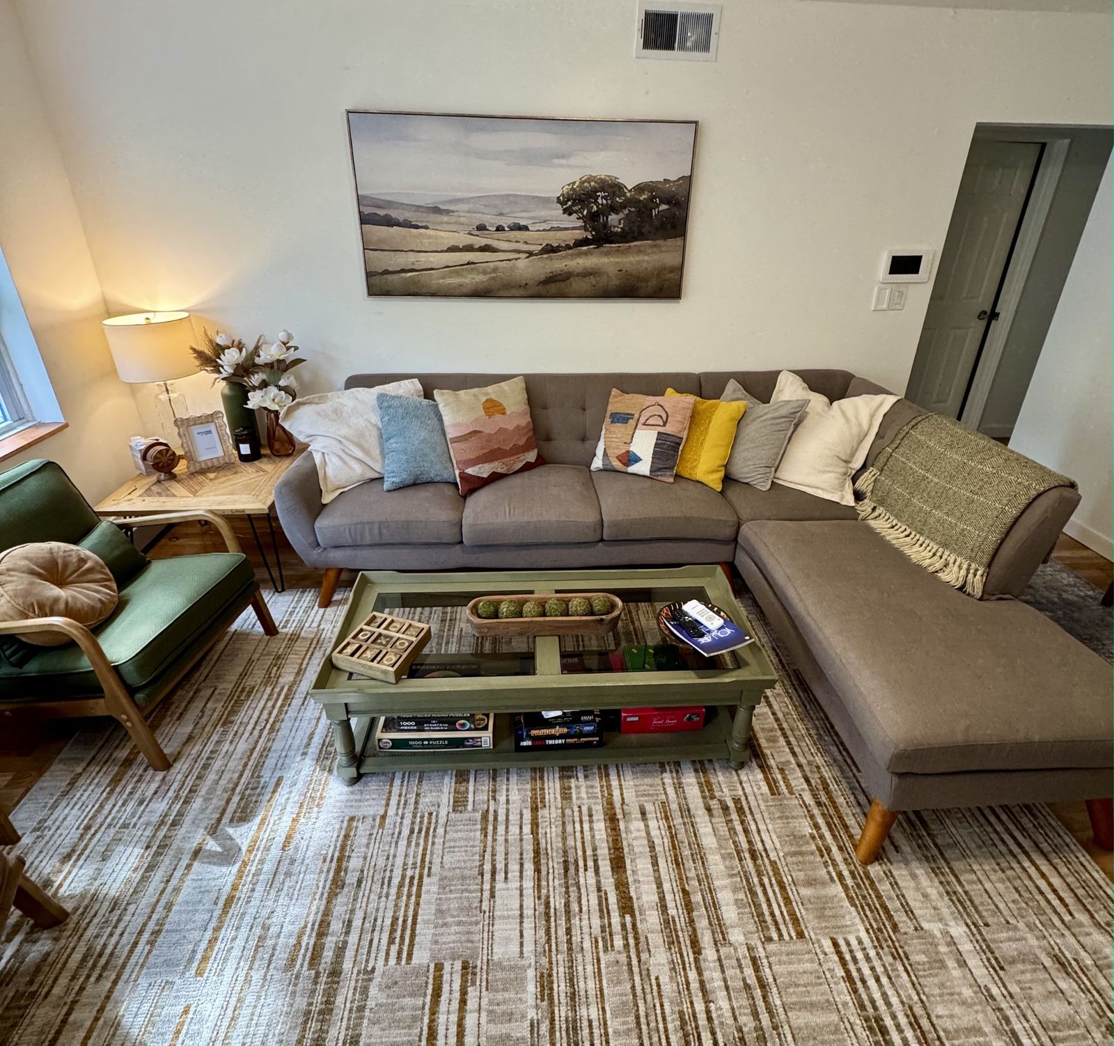 Apartment 2 living room with a grey sectional sofa